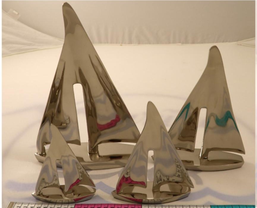 Set of polished aluminium sailboat ornaments