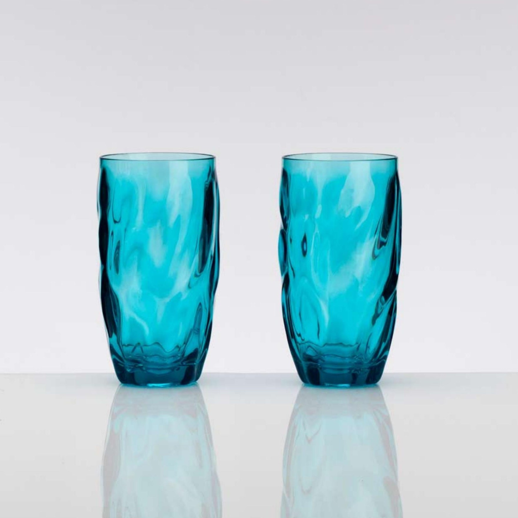 Two aqua-blue textured tumblers